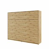 Closed horizontal space-saving Murphy bed in natural oak artisan finish, blending seamlessly into modern bedroom decor