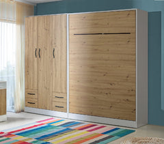 A contemporary dual-tone King Size vertical wall bed with a white carcass and oak front panels, featuring contrasting black metal handles, shown closed.